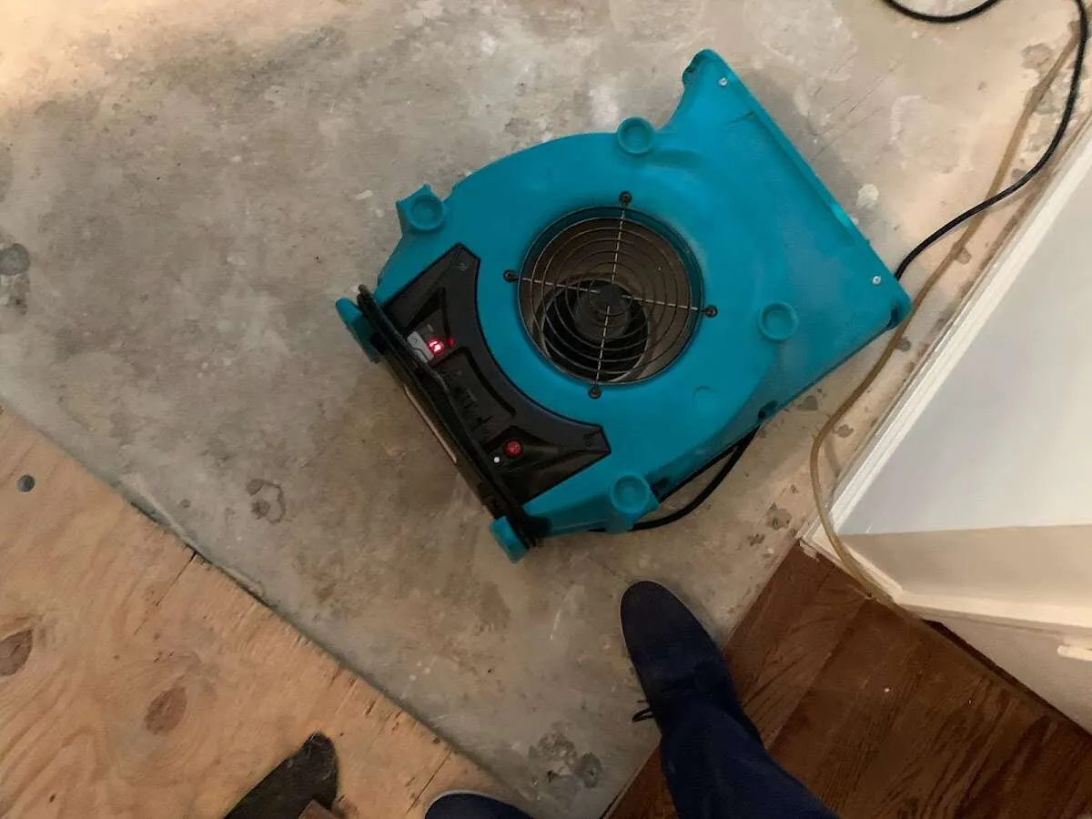 Air mover drying subfloor during Leak Detection & Repair in Albemarle